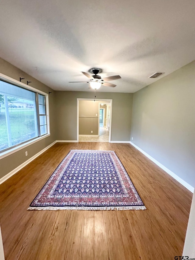 2009 Lindbergh Rd, Tyler, TX 75703 - spare room with wood finished floors and ceiling fan