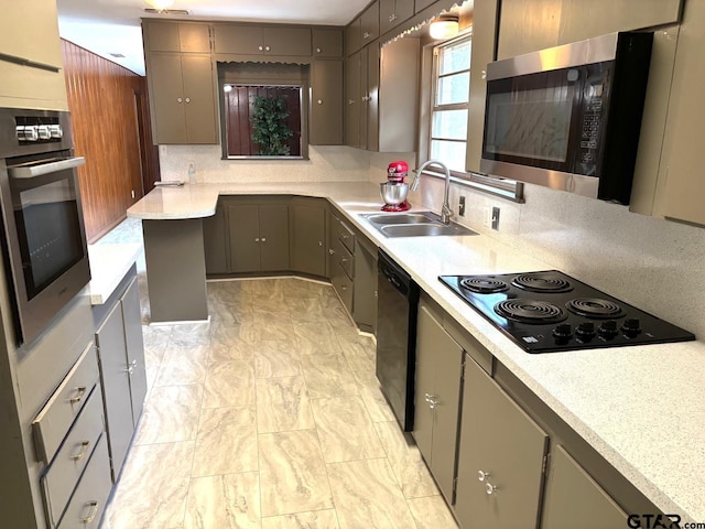 2009 Lindbergh Rd, Tyler, TX 75703 - kitchen with black appliances, light countertops, and gray cabinetry