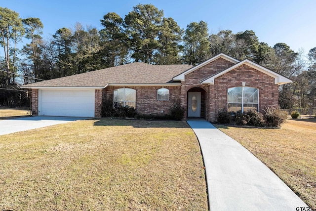 ranch-style home with a garage and a front yard