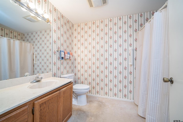 bathroom featuring vanity and toilet