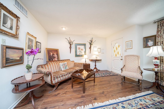 living room with dark hardwood / wood-style flooring