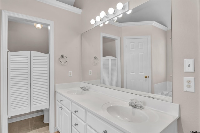 314 Briarcrest Dr, Chandler, TX 75758 - bathroom featuring double vanity, a closet, crown molding, and a sink
