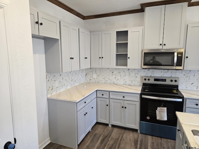 kitchen with tasteful backsplash, ornamental molding, electric range, light stone counters, and dark wood-type flooring