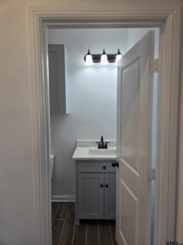 bathroom with vanity and toilet