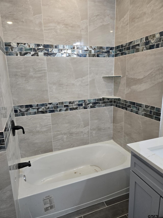 bathroom featuring vanity and tub / shower combination