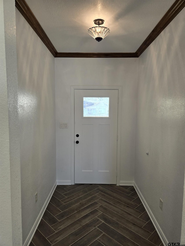 doorway featuring crown molding, dark hardwood / wood-style floors, and a textured ceiling