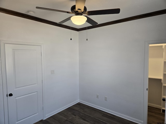 unfurnished room featuring crown molding, dark hardwood / wood-style floors, and ceiling fan