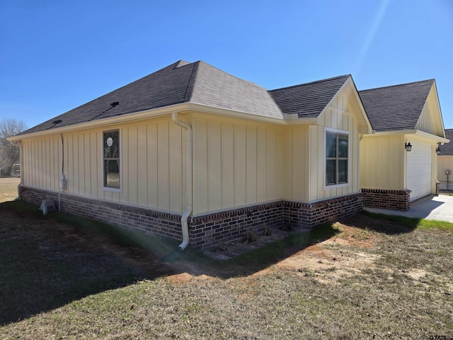 view of side of home featuring a garage