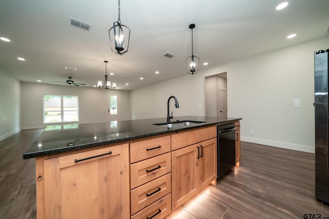 kitchen with sink, light brown cabinetry, dark hardwood / wood-style floors, an island with sink, and pendant lighting