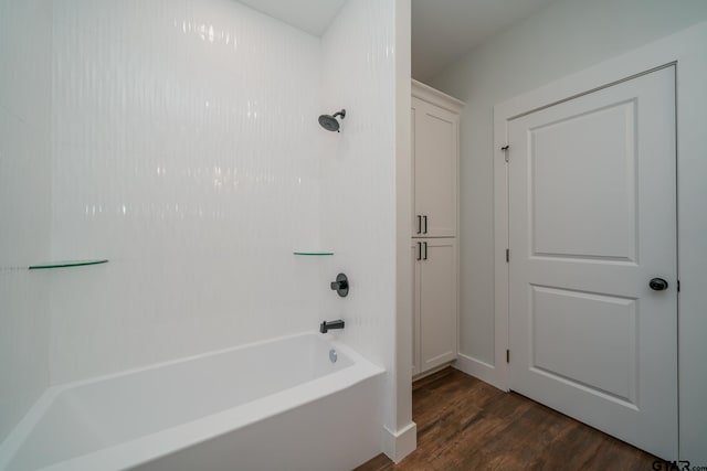 bathroom with shower / bathtub combination and hardwood / wood-style flooring