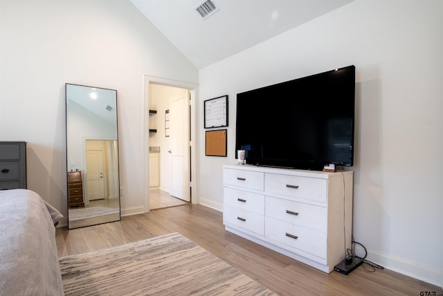 1224 Nate Cir, Bullard, TX 75757 - bedroom featuring lofted ceiling, light wood-style floors, visible vents, and baseboards