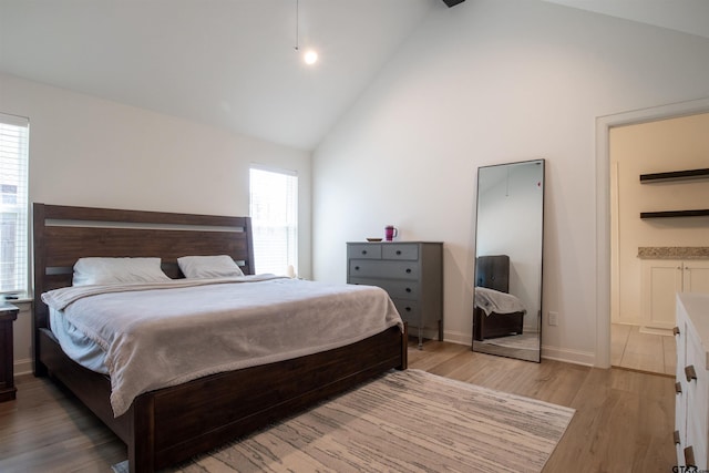 1224 Nate Cir, Bullard, TX 75757 - bedroom featuring light wood-type flooring, baseboards, and high vaulted ceiling