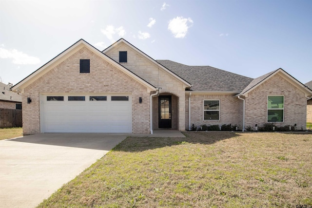 1224 Nate Cir, Bullard, TX 75757 - view of front of house with brick siding, a front yard, roof with shingles, a garage, and driveway