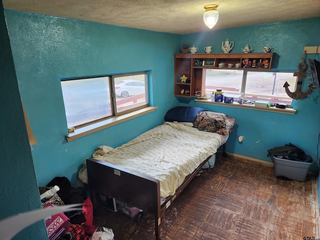 bedroom featuring a textured ceiling