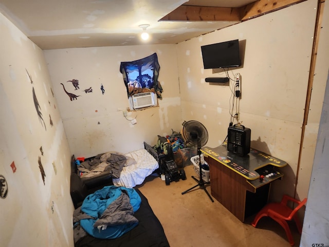 bedroom featuring cooling unit and concrete floors