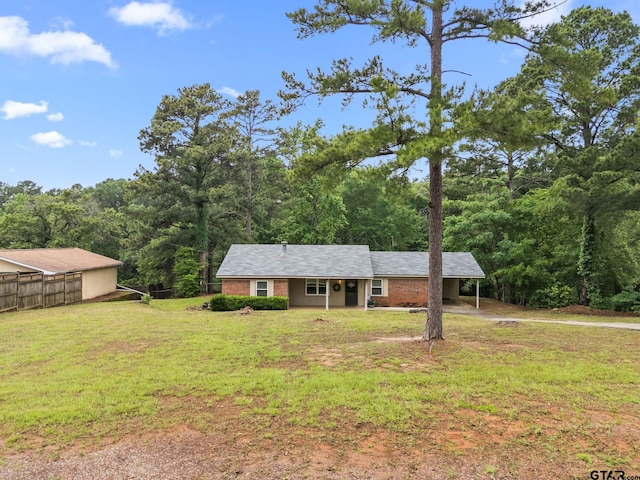 18396 Tall Pines Dr, Tyler, TX 75703 - view of front of property with a carport, driveway, and a wooded view