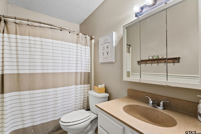 18396 Tall Pines Dr, Tyler, TX 75703 - bathroom with a textured ceiling, toilet, vanity, and a shower with shower curtain