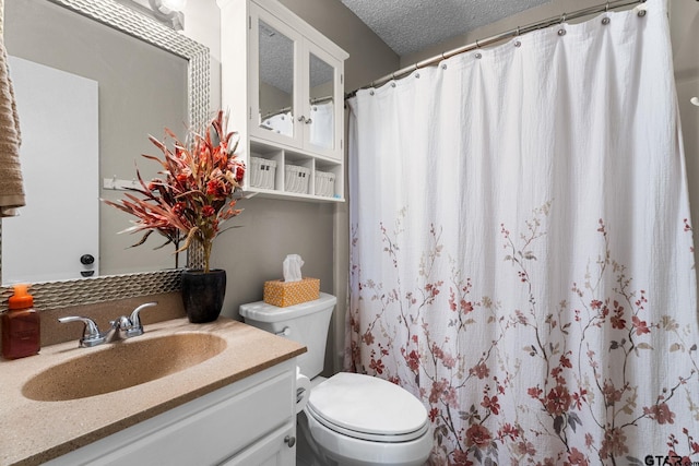18396 Tall Pines Dr, Tyler, TX 75703 - bathroom with toilet, vanity, a textured ceiling, and a shower with shower curtain
