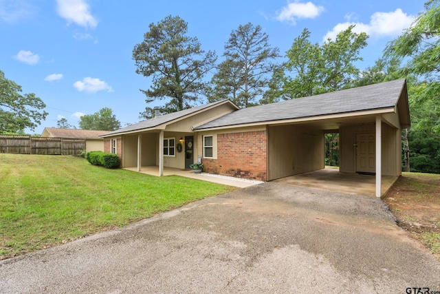 18396 Tall Pines Dr, Tyler, TX 75703 - ranch-style house featuring an attached carport, asphalt driveway, and brick siding