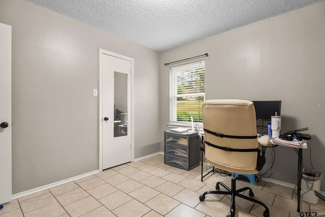 18396 Tall Pines Dr, Tyler, TX 75703 - home office featuring a textured ceiling, light tile patterned floors, and baseboards