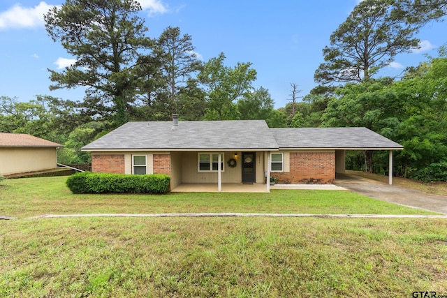 18396 Tall Pines Dr, Tyler, TX 75703 - single story home featuring a front lawn, a carport, concrete driveway, brick siding, and a porch