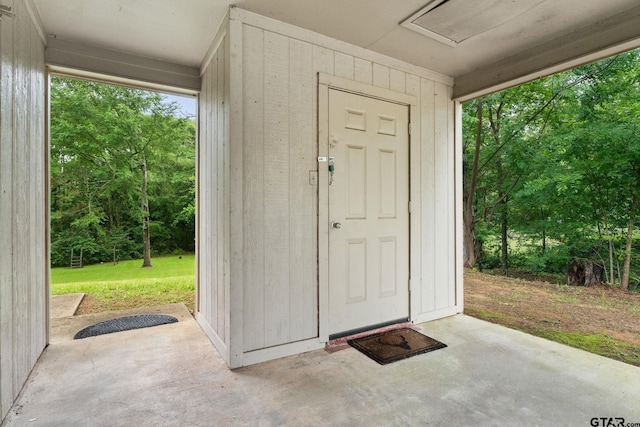 18396 Tall Pines Dr, Tyler, TX 75703 - doorway to property featuring a patio and a lawn
