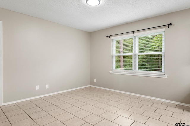 18396 Tall Pines Dr, Tyler, TX 75703 - empty room with a textured ceiling and baseboards