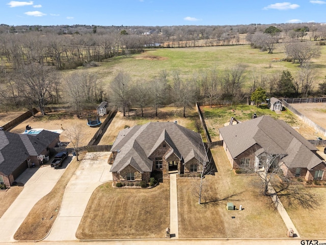 birds eye view of property with a rural view