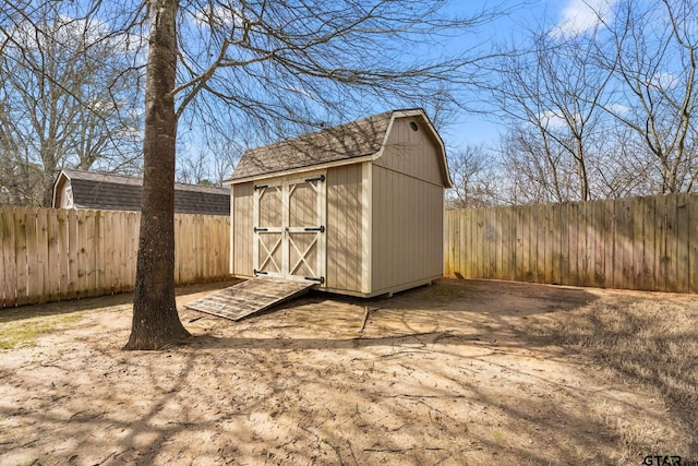 view of shed featuring a fenced backyard