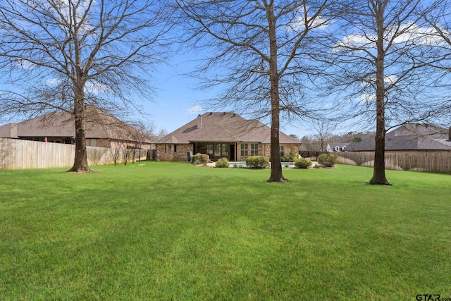 view of yard featuring a fenced backyard