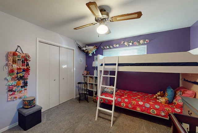 bedroom with ceiling fan, carpet floors, and a closet