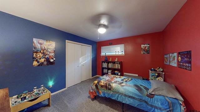 carpeted bedroom featuring ceiling fan and a closet