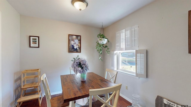 dining area featuring dark hardwood / wood-style floors