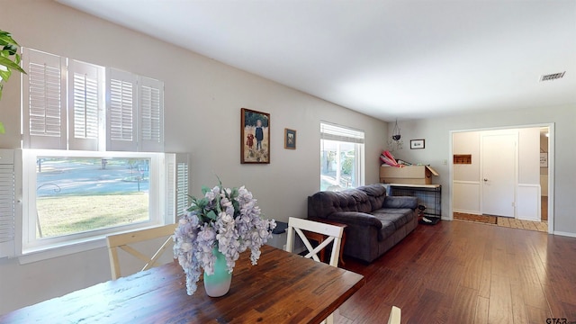 dining space with dark hardwood / wood-style floors