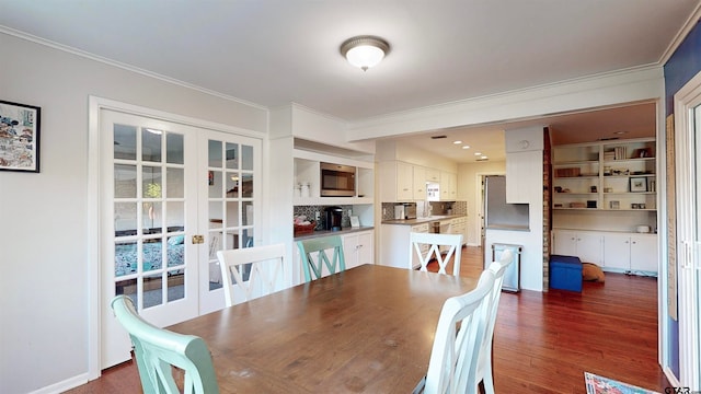 dining area with french doors, dark hardwood / wood-style floors, and ornamental molding