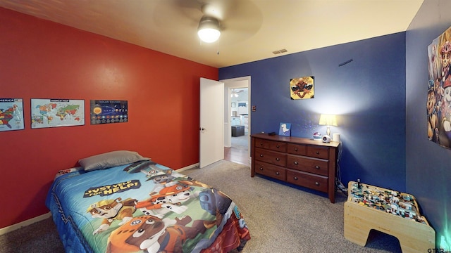 bedroom with ceiling fan and light carpet