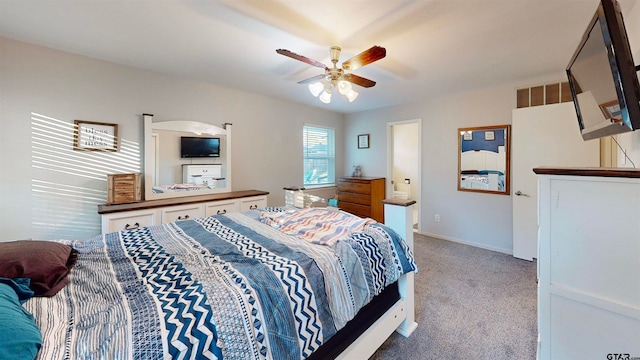 bedroom featuring ceiling fan and light carpet