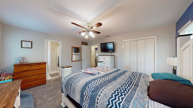 carpeted bedroom with ceiling fan and a closet