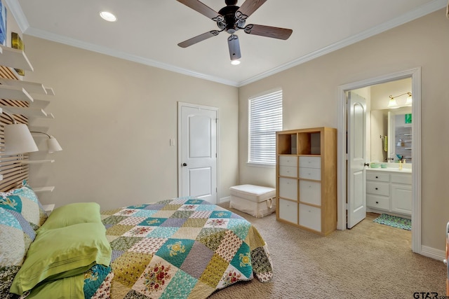 bedroom with ornamental molding, ensuite bath, ceiling fan, and light colored carpet