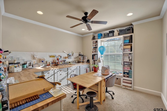 carpeted office with ceiling fan and ornamental molding