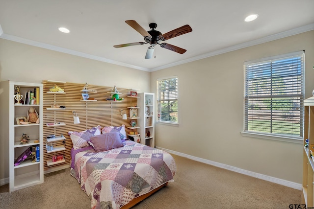 bedroom with carpet floors, ceiling fan, and crown molding