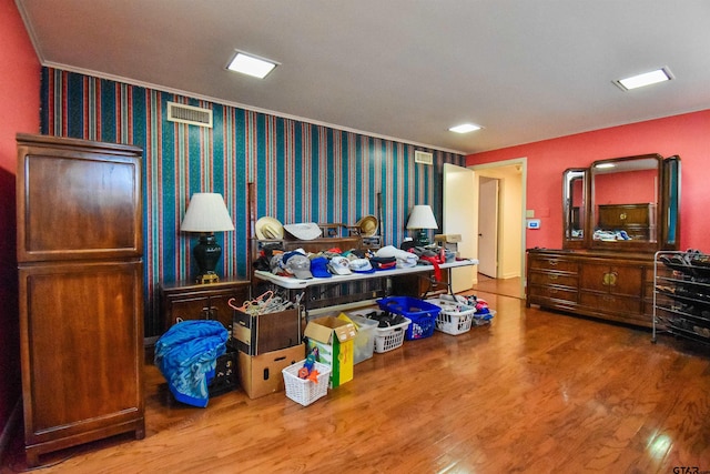 miscellaneous room featuring wood-type flooring