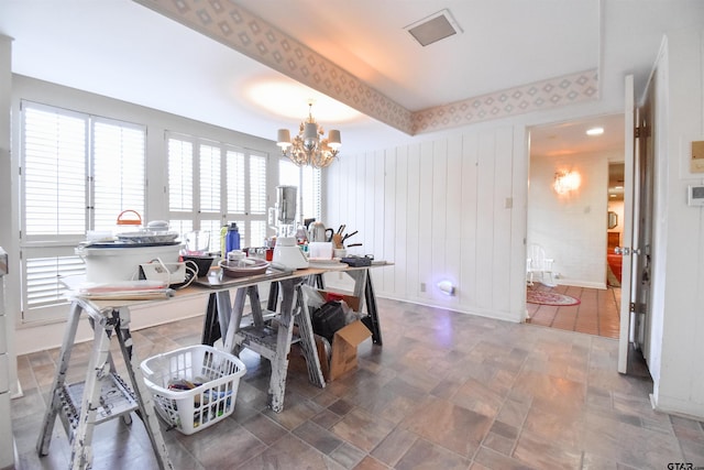 dining space featuring a notable chandelier