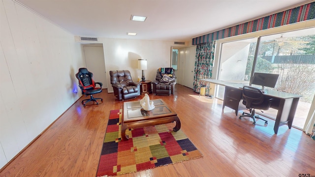 home office with hardwood / wood-style floors