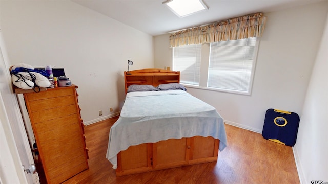 bedroom with light hardwood / wood-style flooring