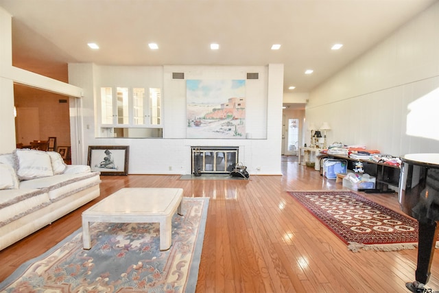 living room featuring a fireplace and hardwood / wood-style flooring