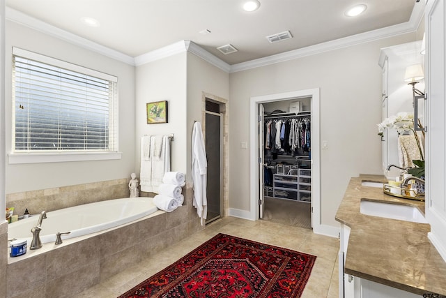 bathroom with vanity, tile patterned flooring, crown molding, and plus walk in shower