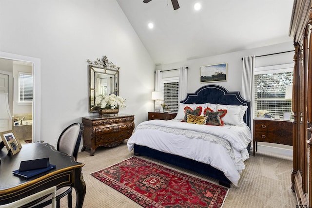 carpeted bedroom featuring ceiling fan, connected bathroom, and high vaulted ceiling