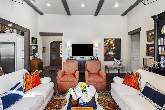 living room featuring hardwood / wood-style flooring and beamed ceiling