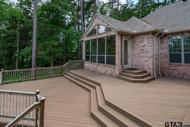 wooden terrace featuring a sunroom